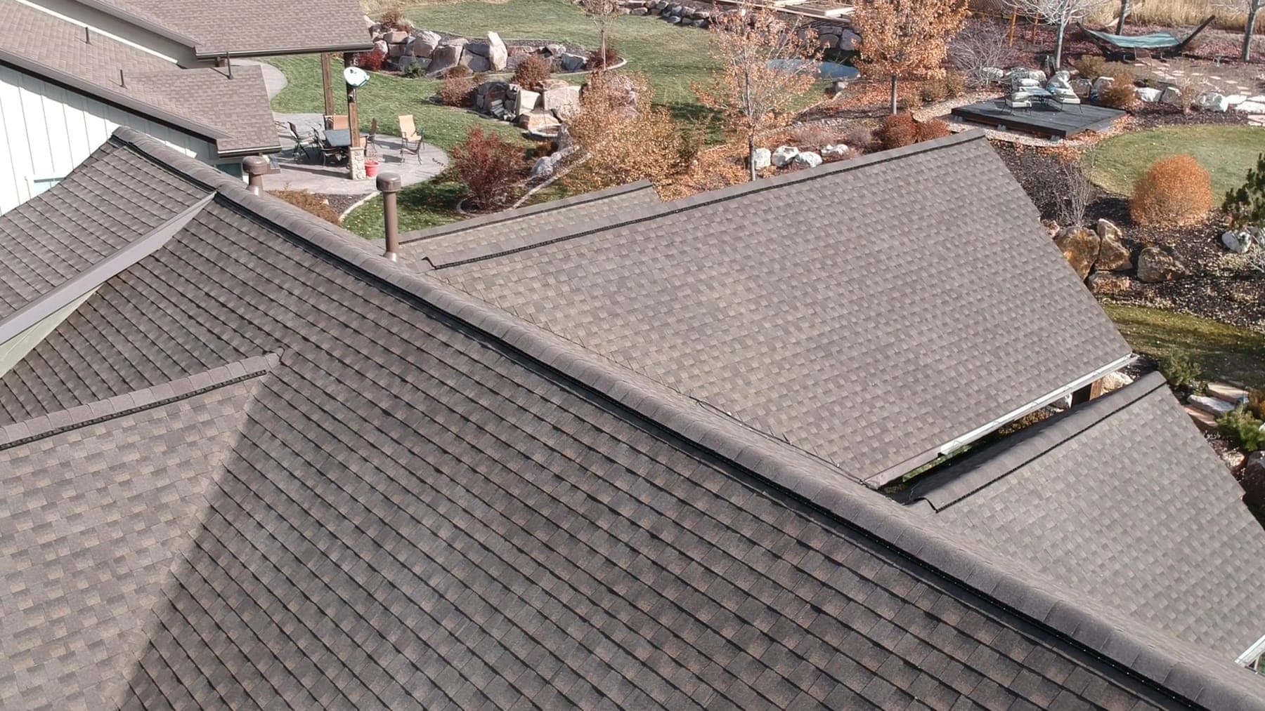 Aerial view of a finished residential roof replacement by Legacy Roofing